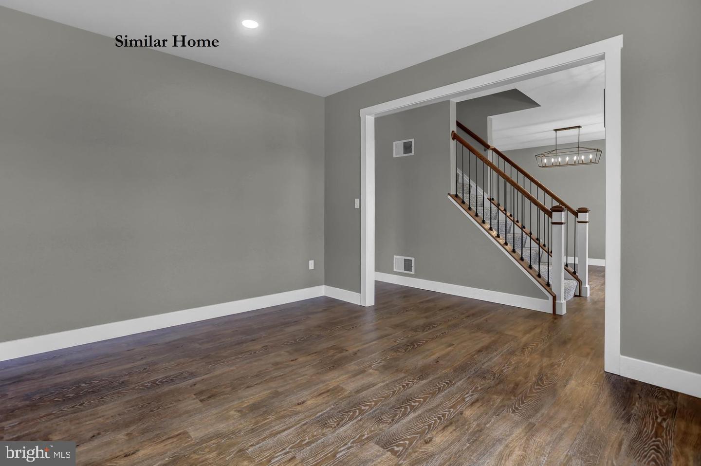Hill Road, Unit CAMDEN New Freedom, PA 17349 - Photo 10 of 52 a view of an empty room with wooden floor and stairs