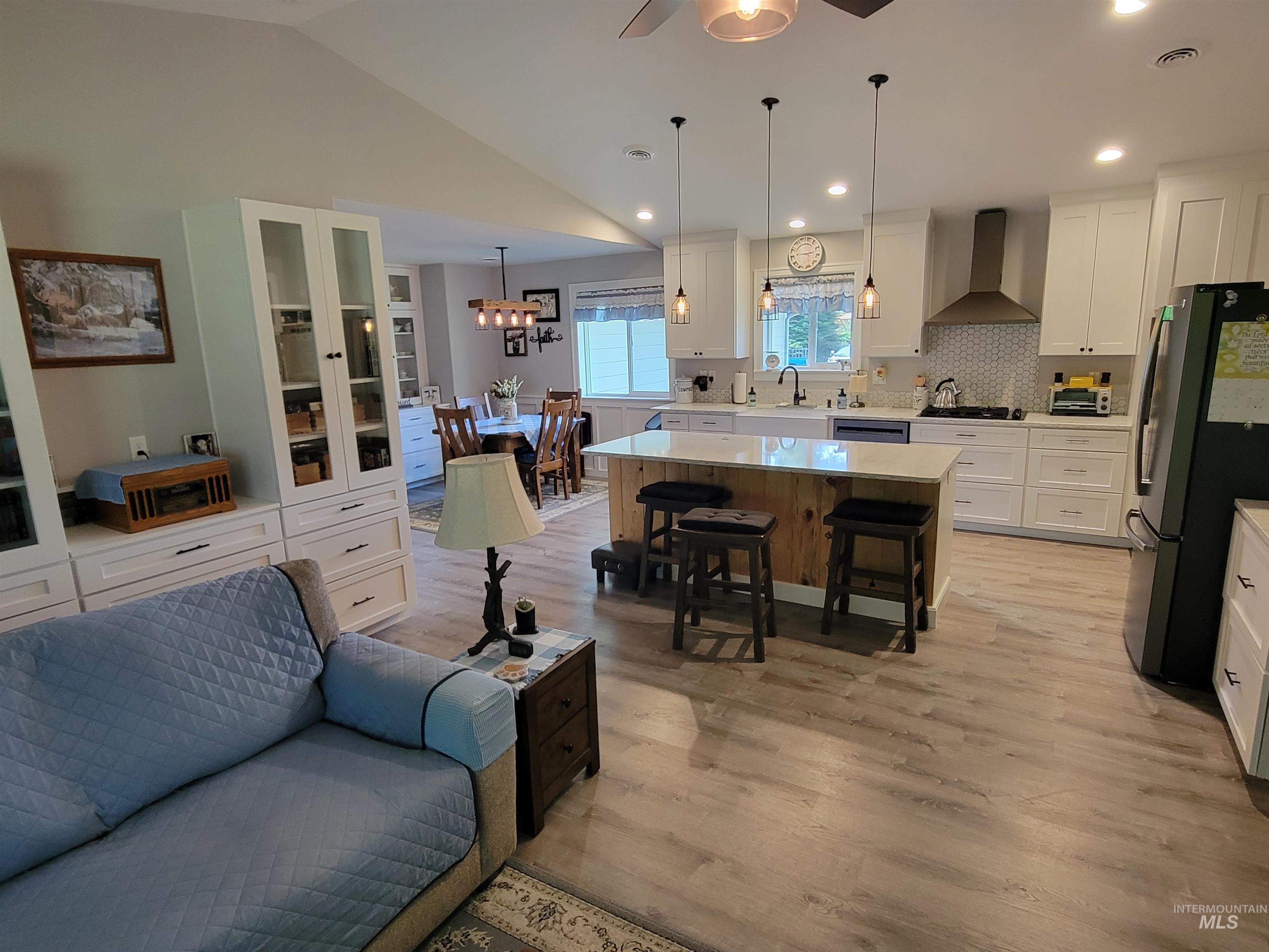 437 Clearcreek Road Kooskia, ID 83539 - Photo 14 of 45 Living area with light wood-style flooring, a ceiling fan, recessed lighting, lofted ceiling, and a chandelier