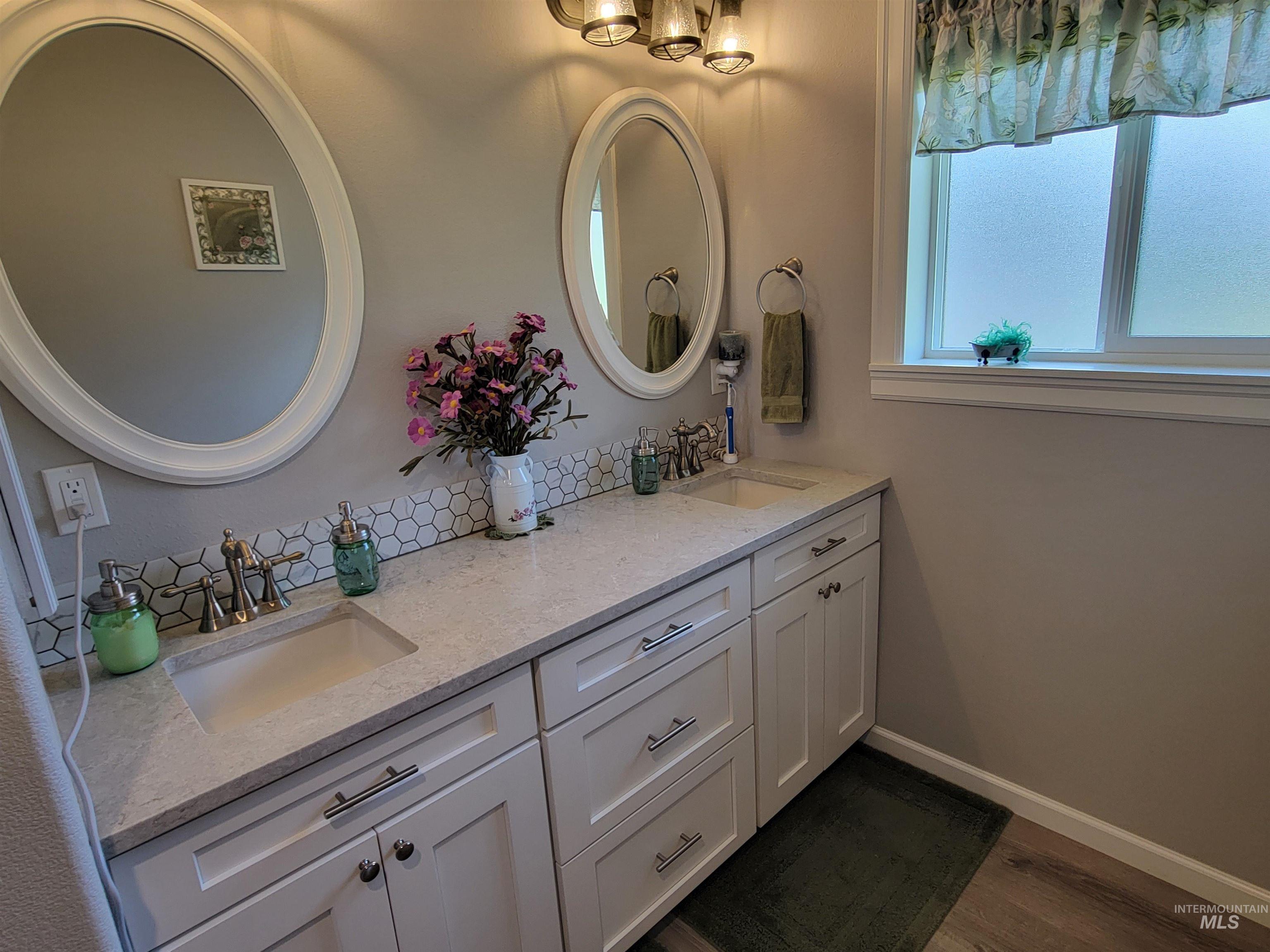 437 Clearcreek Road Kooskia, ID 83539 - Photo 20 of 45 Full bathroom with double vanity and wood finished floors