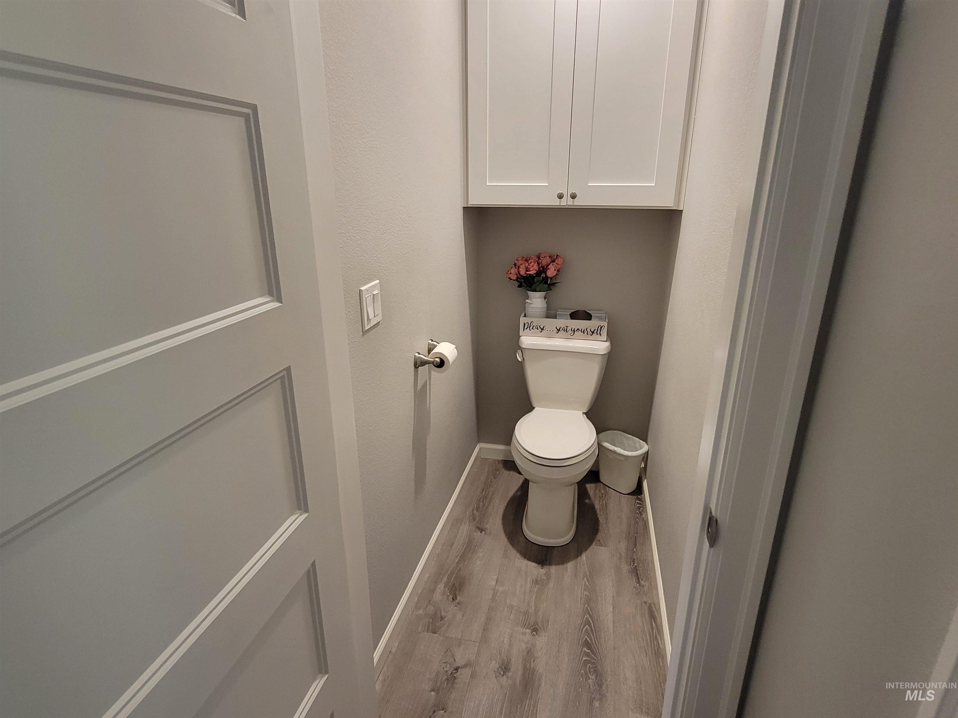 437 Clearcreek Road Kooskia, ID 83539 - Photo 21 of 45 Bathroom featuring wood finished floors and toilet