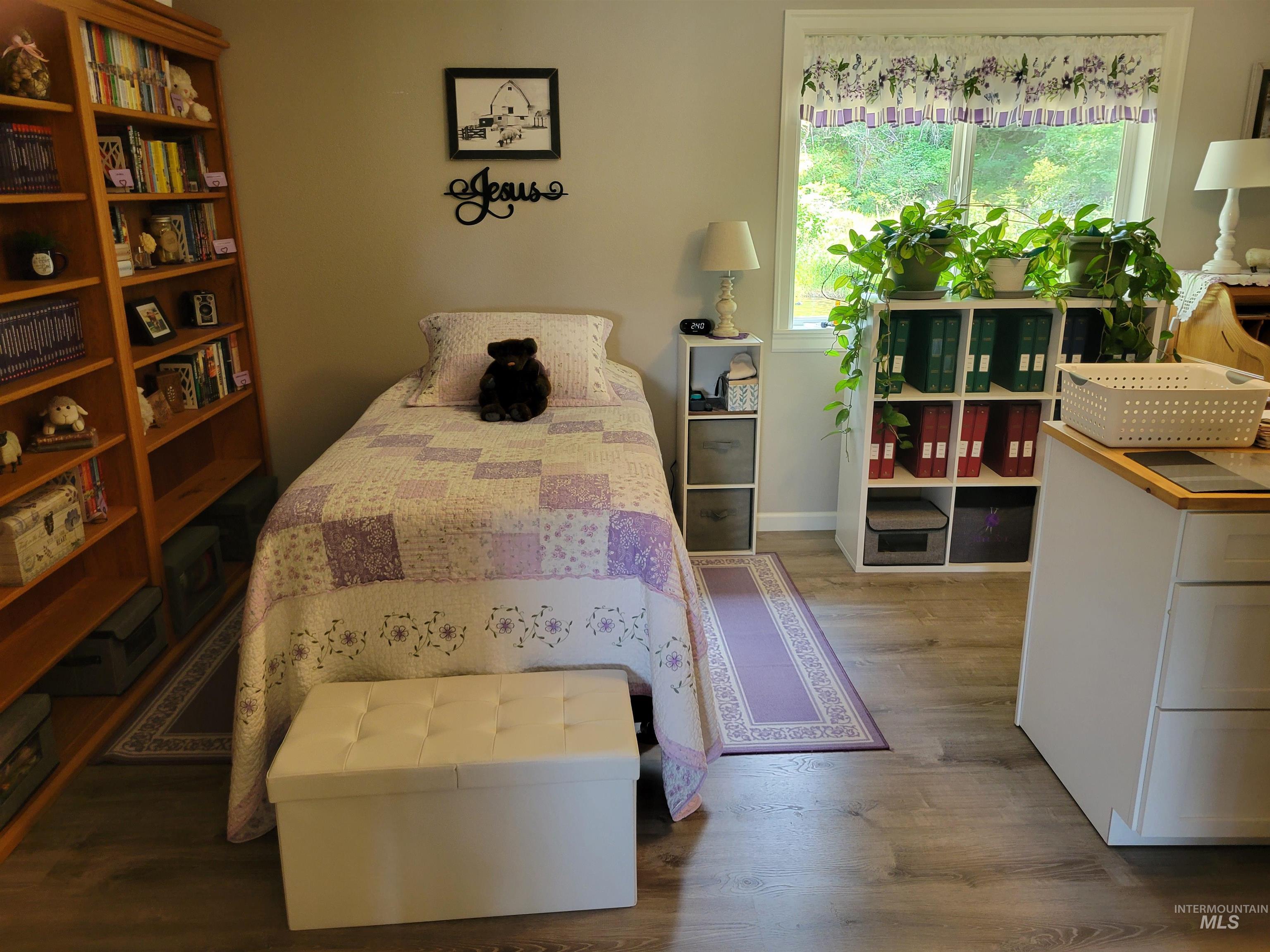 437 Clearcreek Road Kooskia, ID 83539 - Photo 23 of 45 Bedroom with wood finished floors