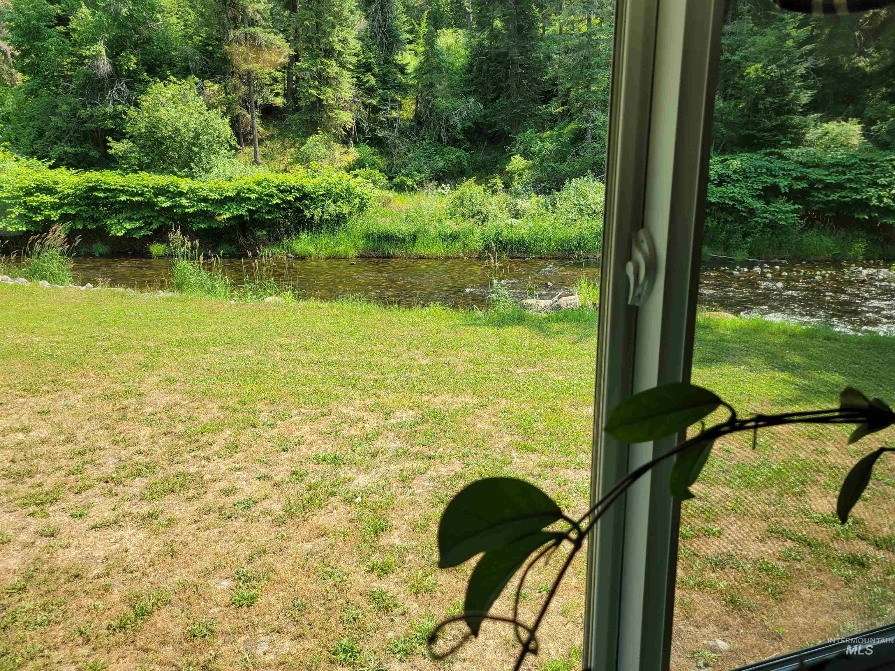 437 Clearcreek Road Kooskia, ID 83539 - Photo 31 of 45 View of grassy yard with a water view