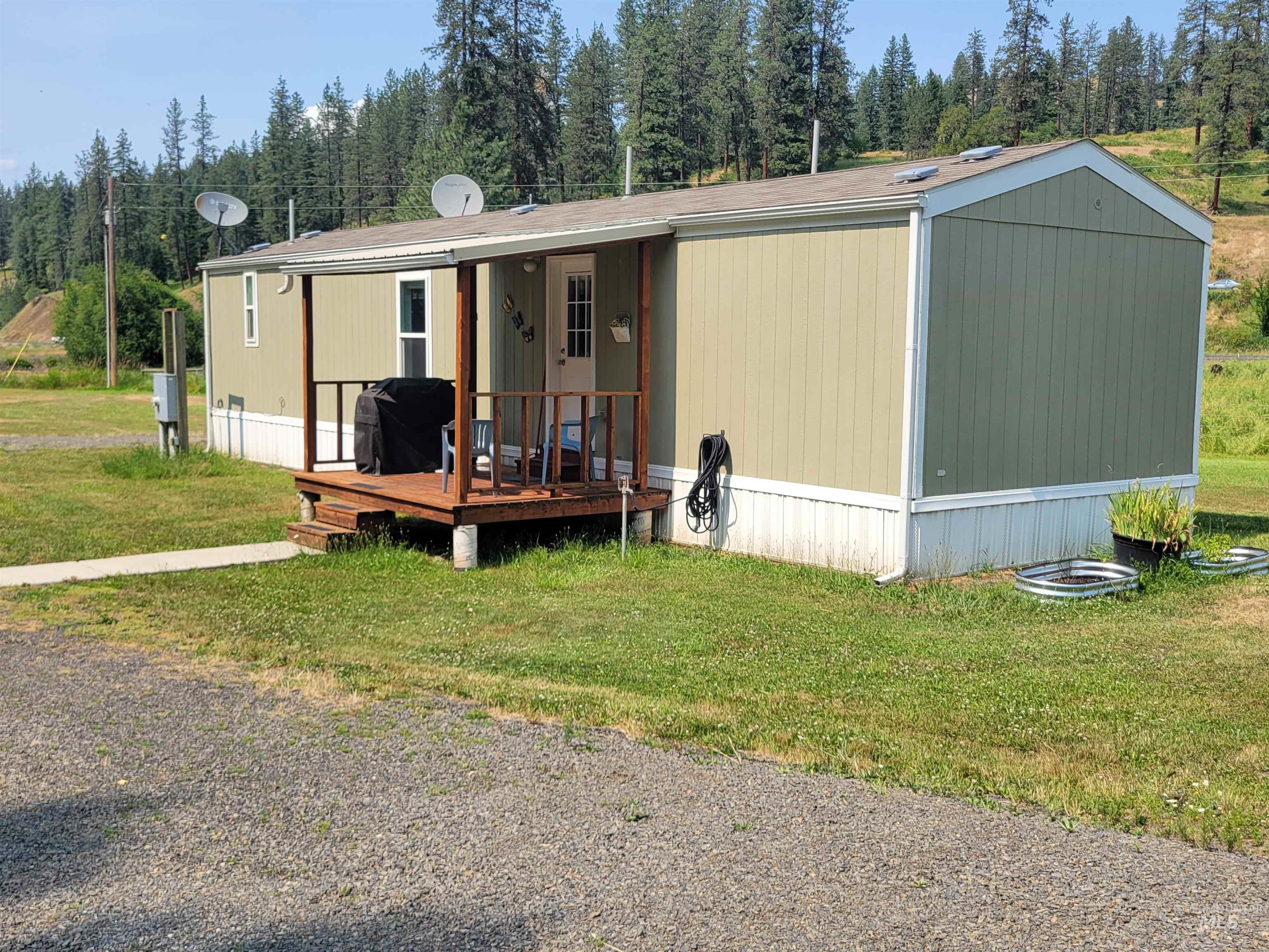437 Clearcreek Road Kooskia, ID 83539 - Photo 34 of 45 Manufactured / mobile home with a front yard and a wooden deck