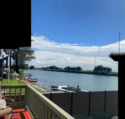 a view of a backyard with sitting area