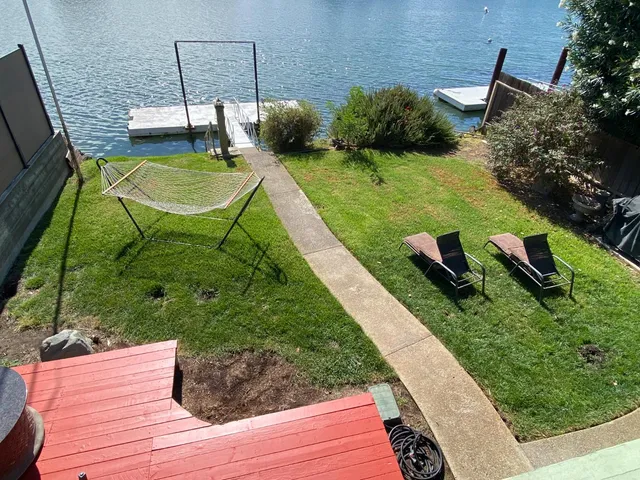 a front view of a house with garden and porch