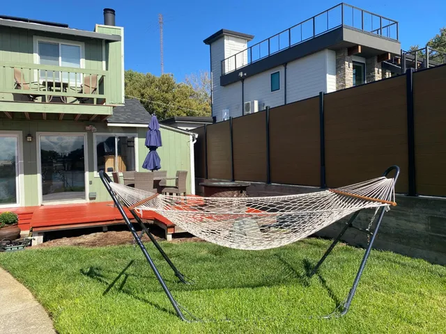 a view of house with yard outdoor seating and entertaining space