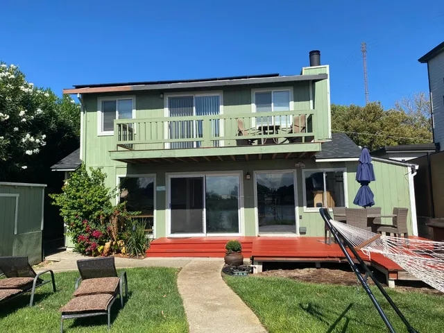 a backyard of a house with seating space