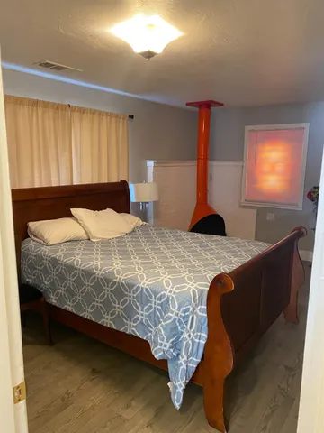 a living room with a flat screen tv and a fireplace