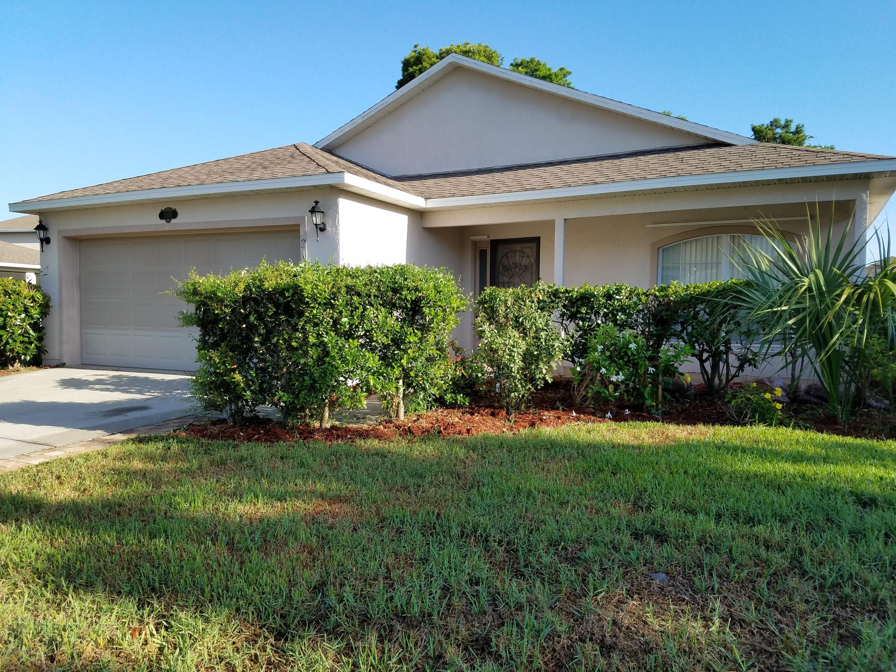 2105 Spring Creek Circle Palm Bay, FL 32905 - Photo 1 of 25 FRONT