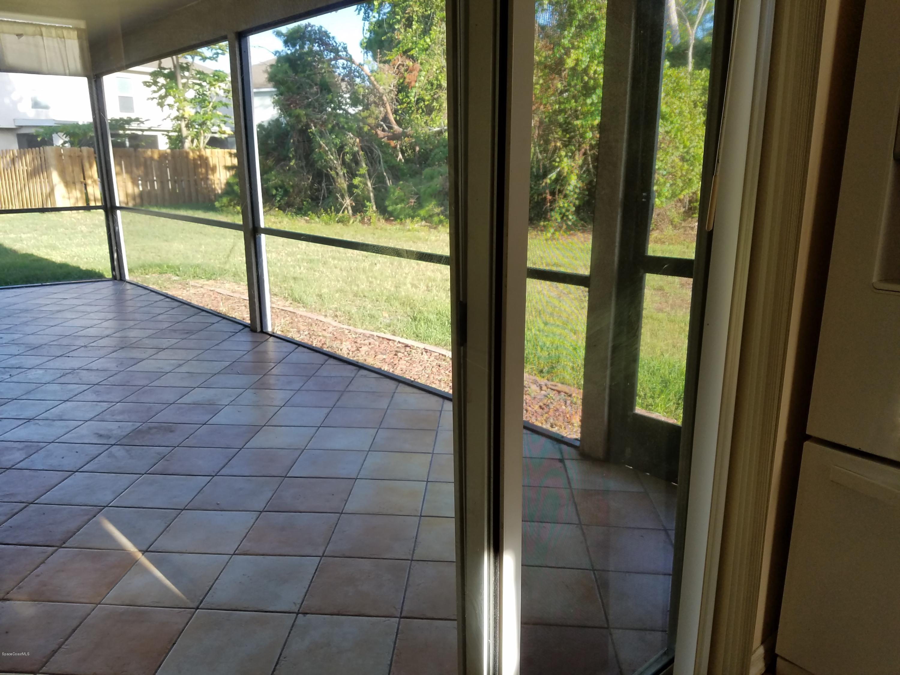 2105 Spring Creek Circle Palm Bay, FL 32905 - Photo 16 of 25 Tiled/Screened Patio