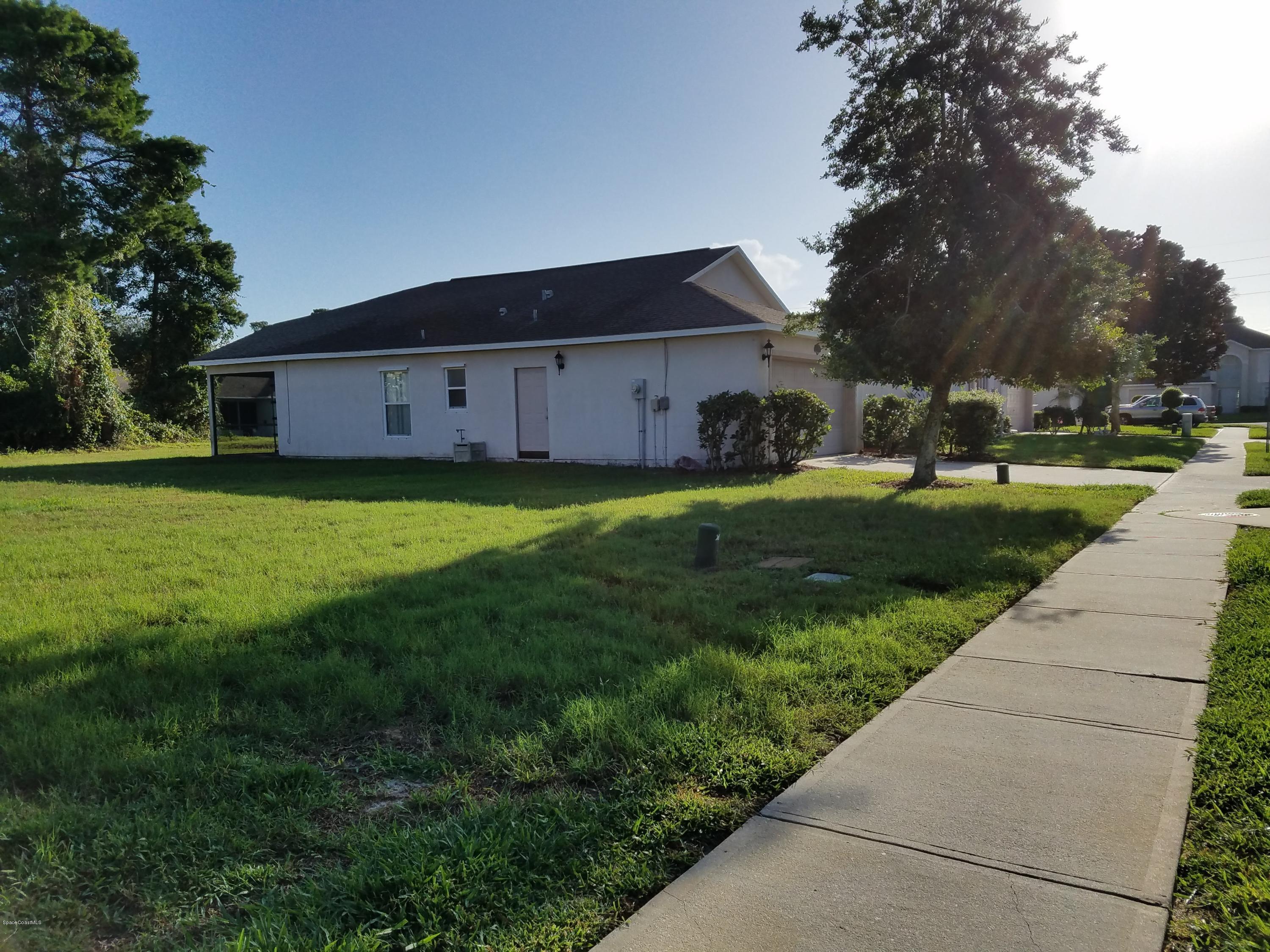 2105 Spring Creek Circle Palm Bay, FL 32905 - Photo 20 of 25 Vacant lot next door