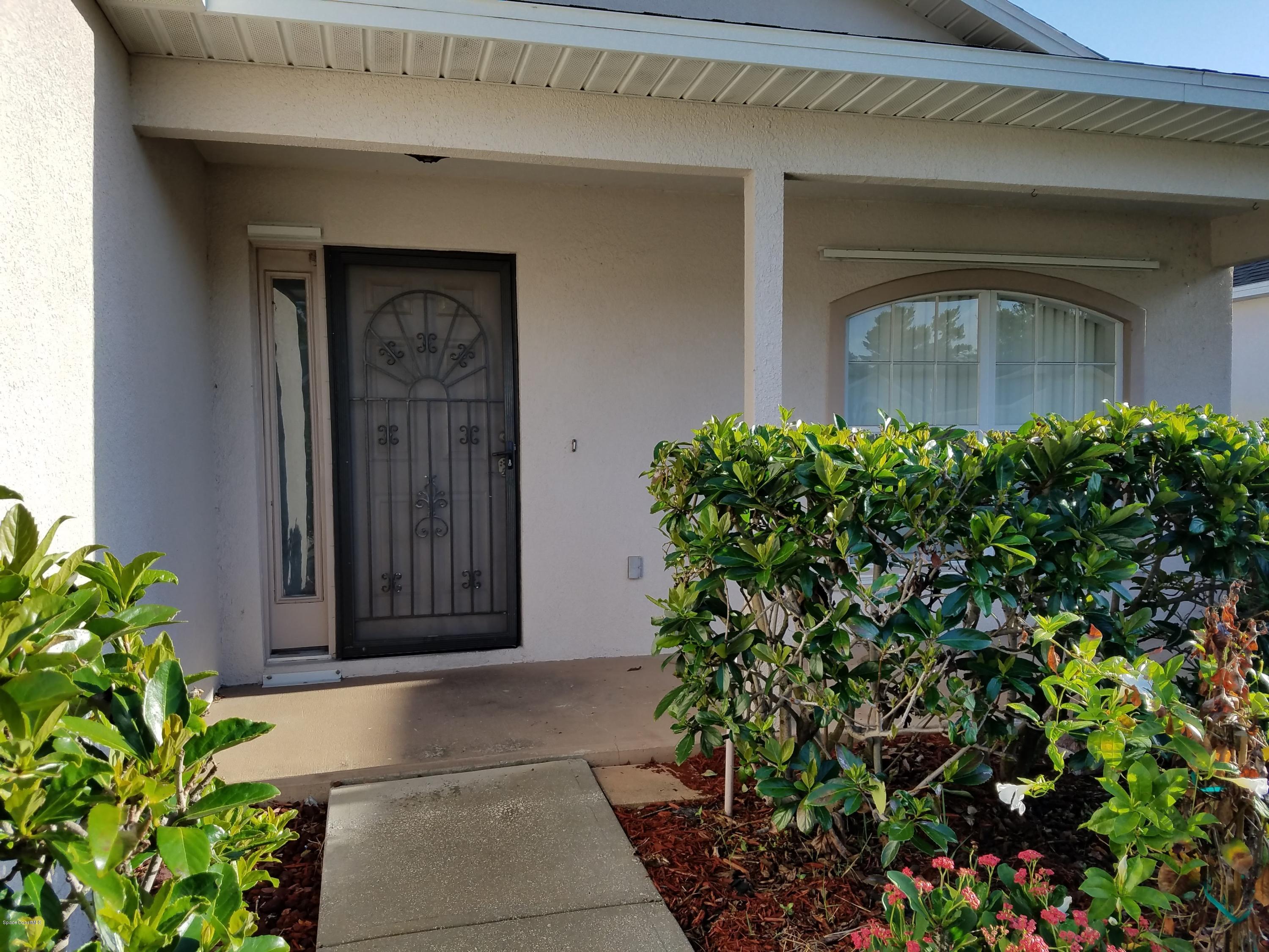 2105 Spring Creek Circle Palm Bay, FL 32905 - Photo 3 of 25 Covered Veranda
