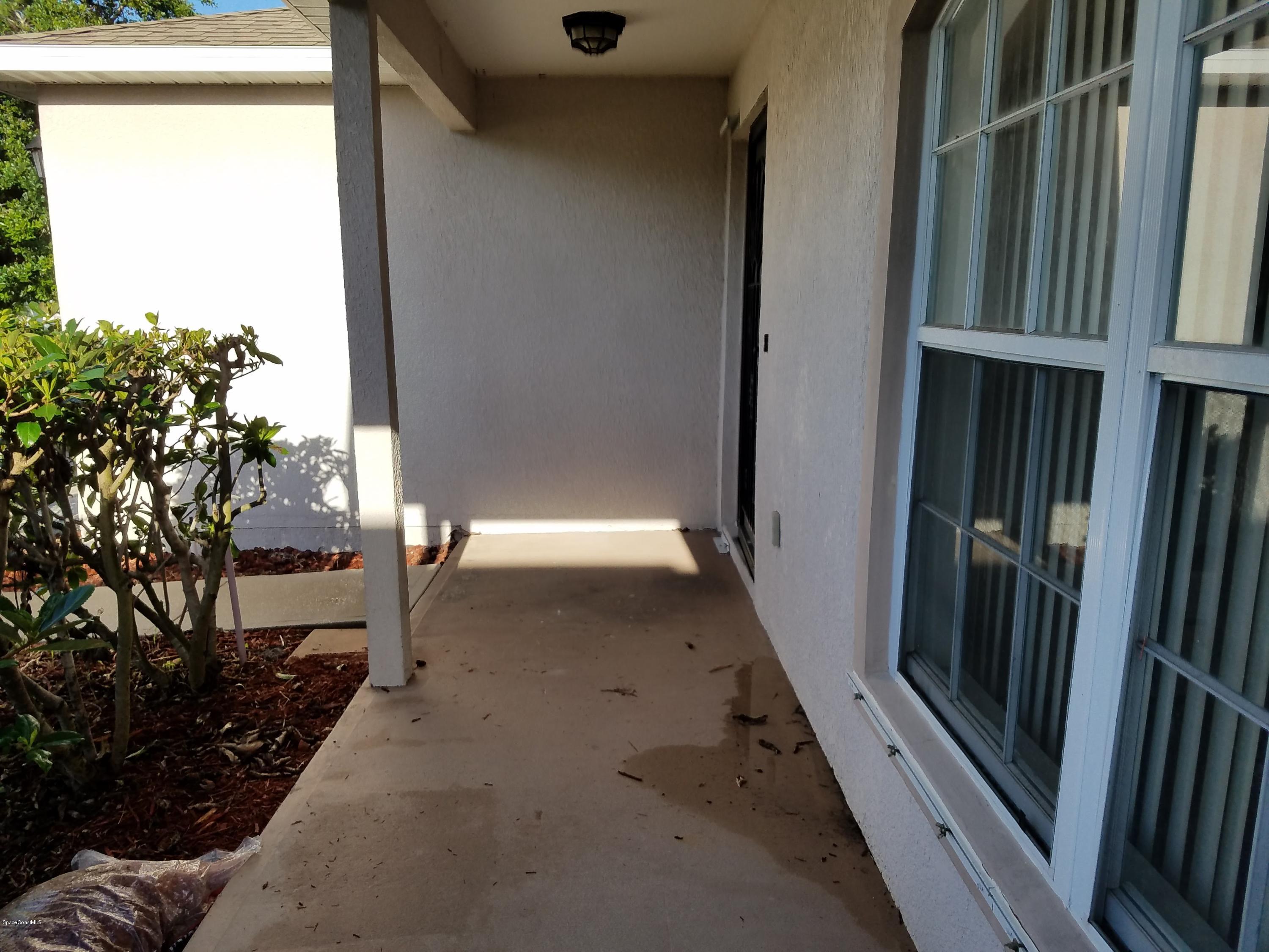 2105 Spring Creek Circle Palm Bay, FL 32905 - Photo 4 of 25 Covered Veranda