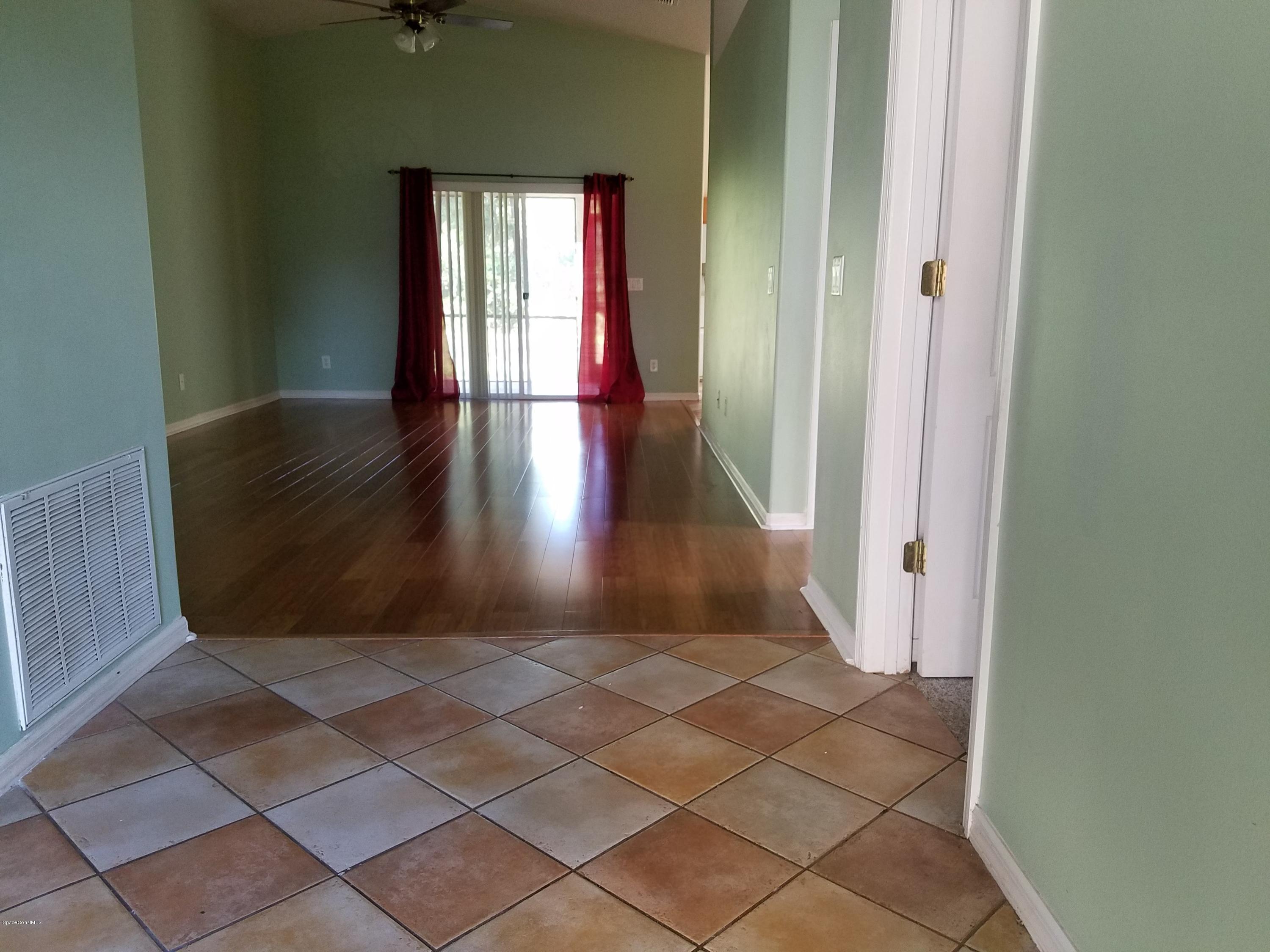 2105 Spring Creek Circle Palm Bay, FL 32905 - Photo 7 of 25 Foyer to Living area