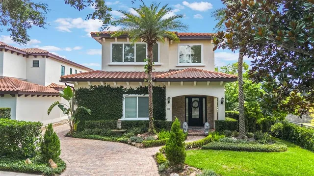 front view of a house with potted plants