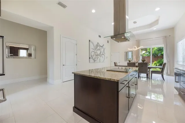 a kitchen with stainless steel appliances granite countertop a stove and a refrigerator