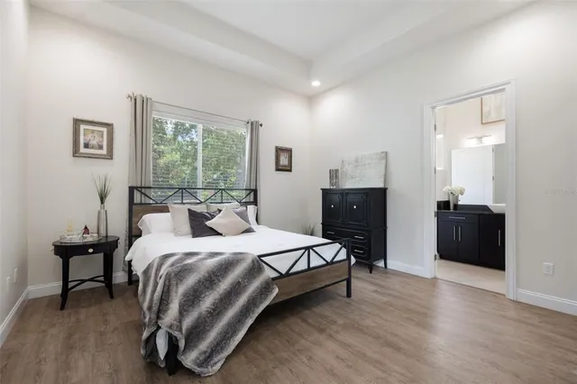 a bedroom with a bed and a chair