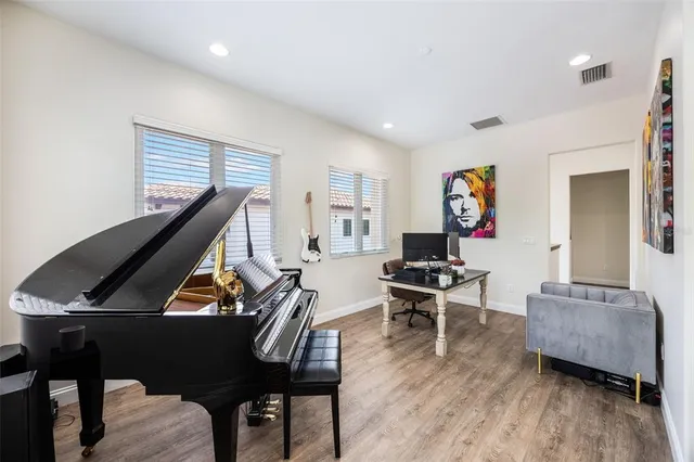 a room with furniture and wooden floor