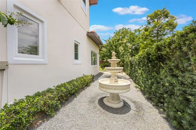 a view of backyard with a table and chairs