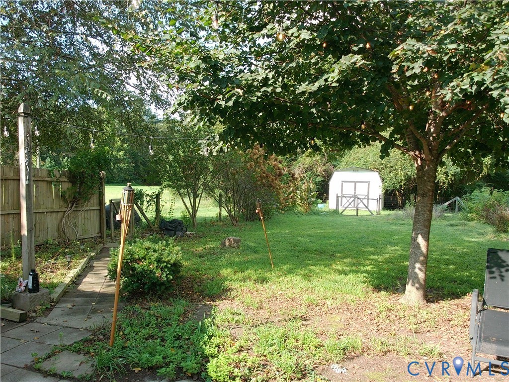 3284 Chickahominy Road Toano, VA 23168 - Photo 26 of 26 Expansive grassy yard featuring mature trees, a ga