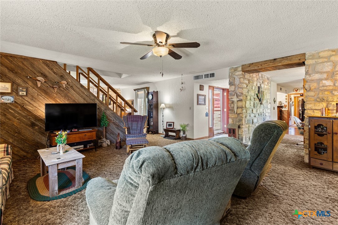 1024 Backstrom Crossing Belton, TX 76513 - Photo 12 of 47 a living room with furniture a flat screen tv and a window