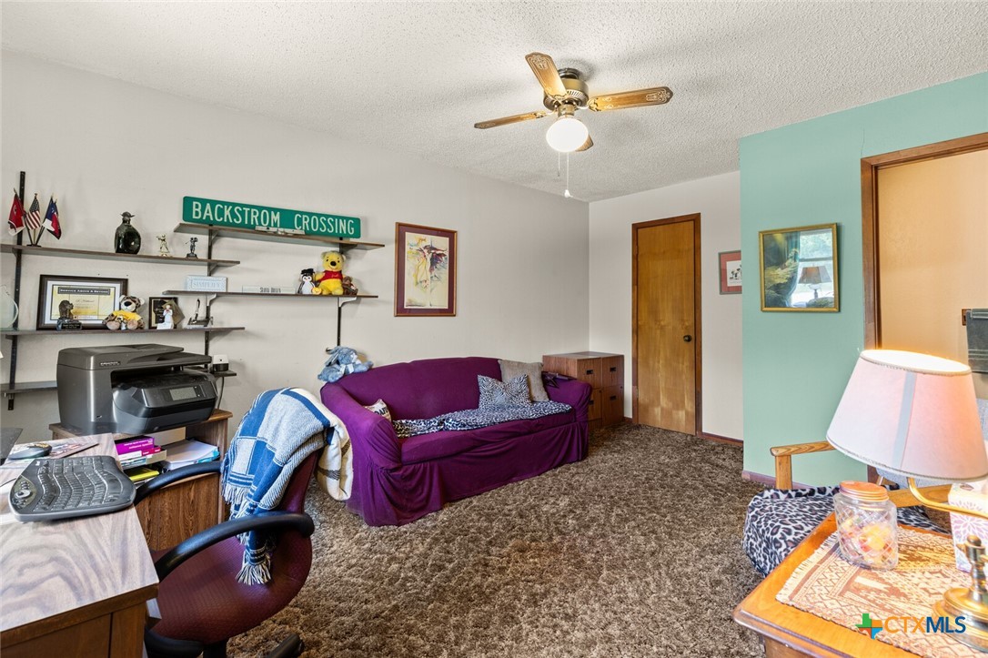 1024 Backstrom Crossing Belton, TX 76513 - Photo 17 of 47 a bedroom with furniture and a chandelier