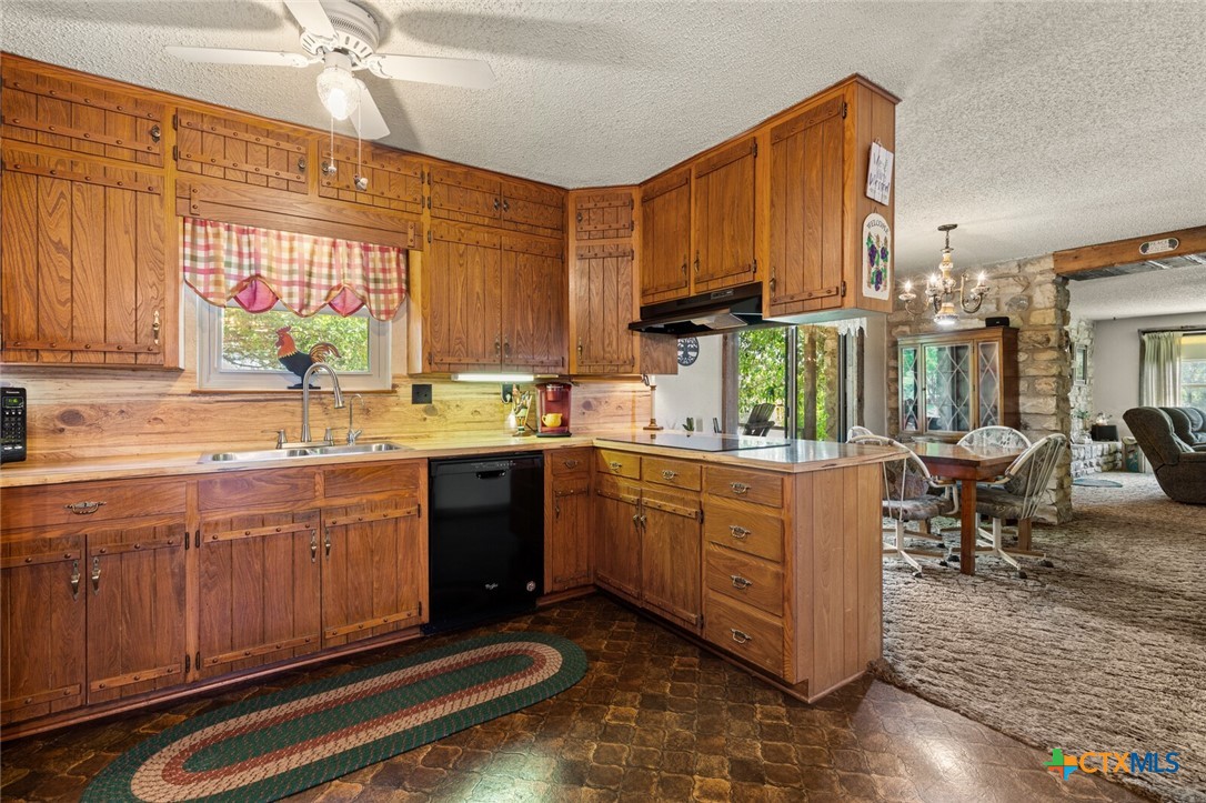 1024 Backstrom Crossing Belton, TX 76513 - Photo 23 of 47 a kitchen with sink cabinets and window