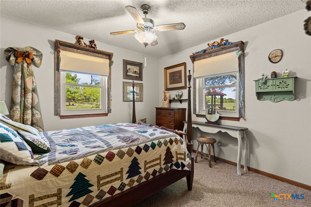 1024 Backstrom Crossing Belton, TX 76513 - Photo 25 of 47 a bedroom with a bed and a table in it