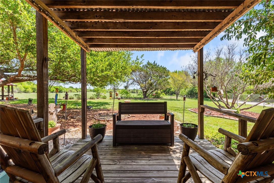 1024 Backstrom Crossing Belton, TX 76513 - Photo 30 of 47 a view of a chairs and table in the patio next to a yard