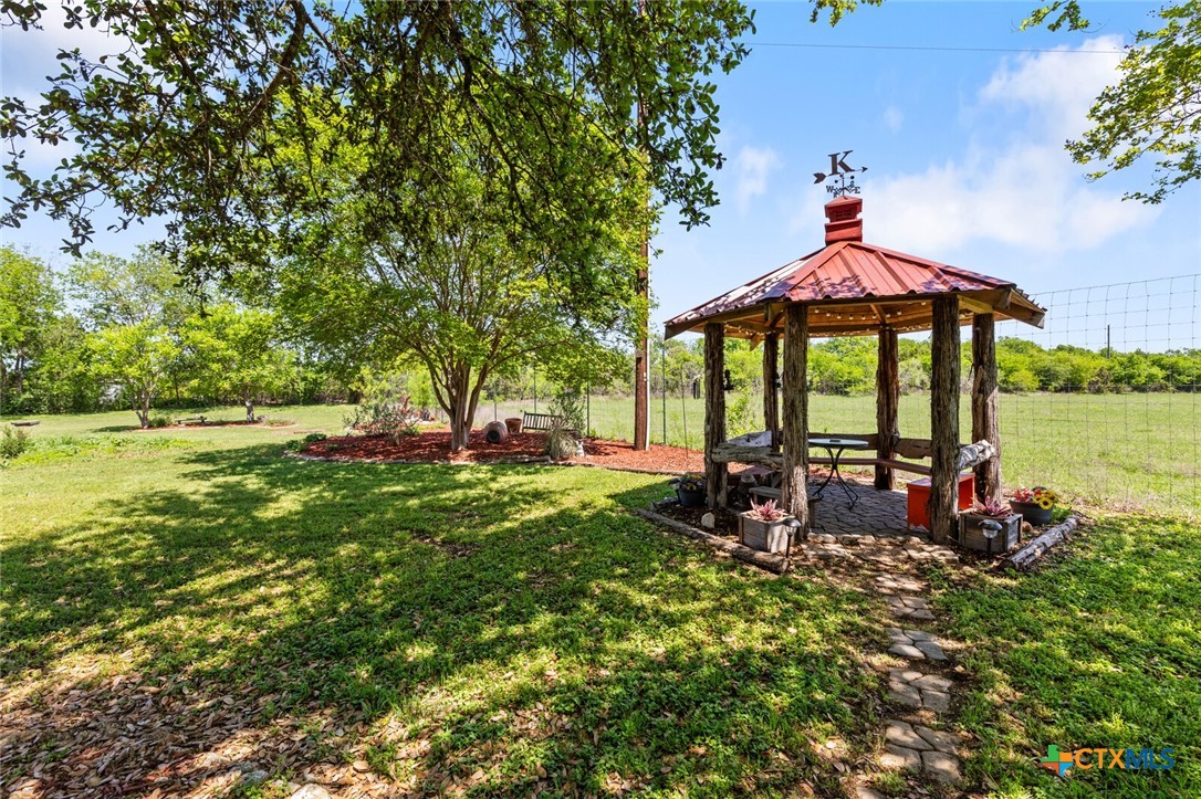 1024 Backstrom Crossing Belton, TX 76513 - Photo 32 of 47 a view of a table and chairs in the garden