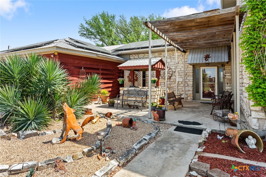 1024 Backstrom Crossing Belton, TX 76513 - Photo 4 of 47 a view of a patio with chairs and potted plants
