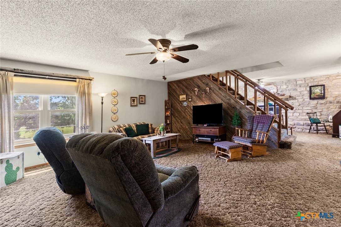 1024 Backstrom Crossing Belton, TX 76513 - Photo 8 of 47 a living room with furniture a fireplace and a large window
