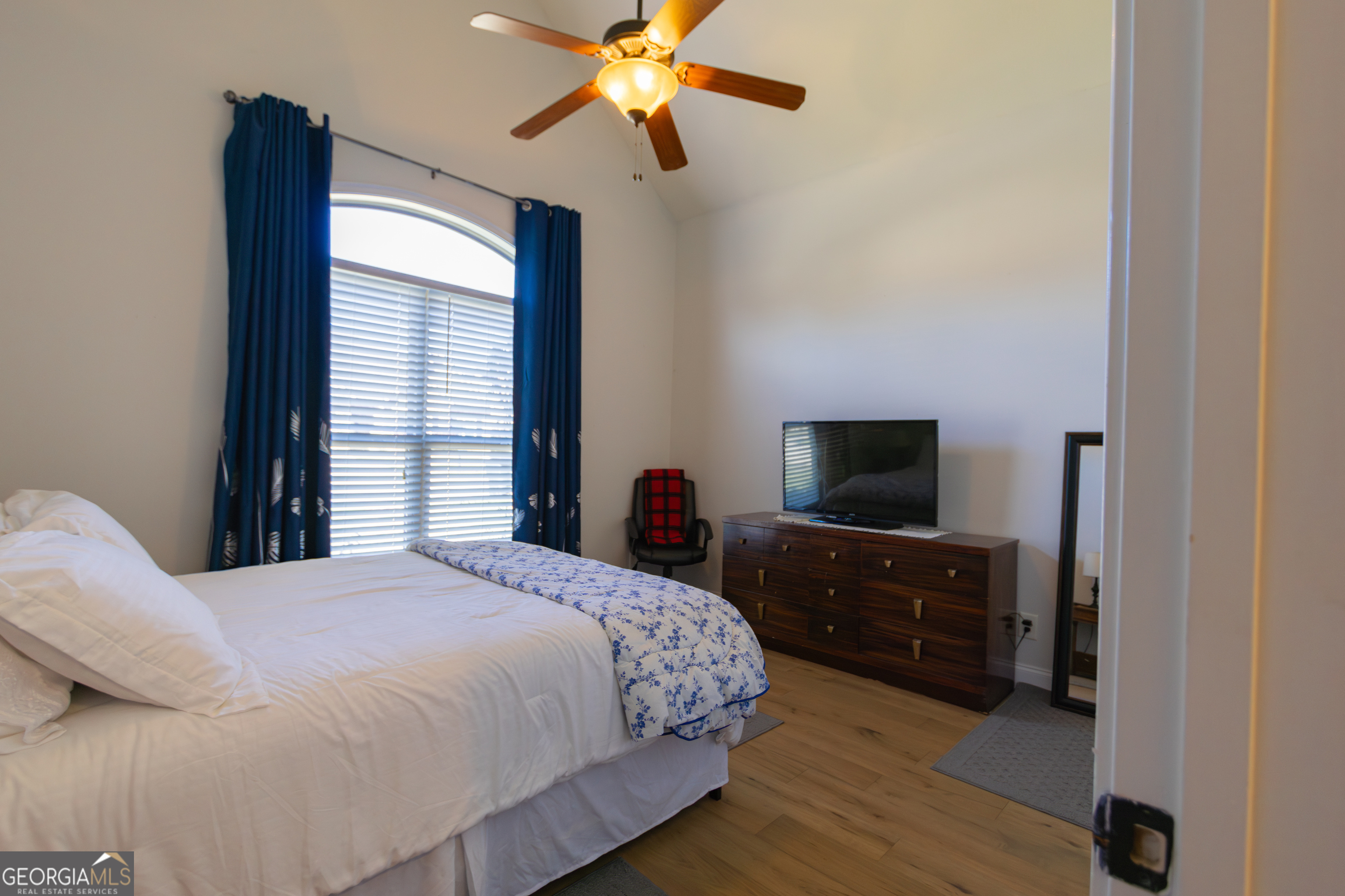 135 Parkview Grove Kathleen, GA 31047 - Photo 11 of 35 a bedroom with a bed and a flat tv screen on dresser