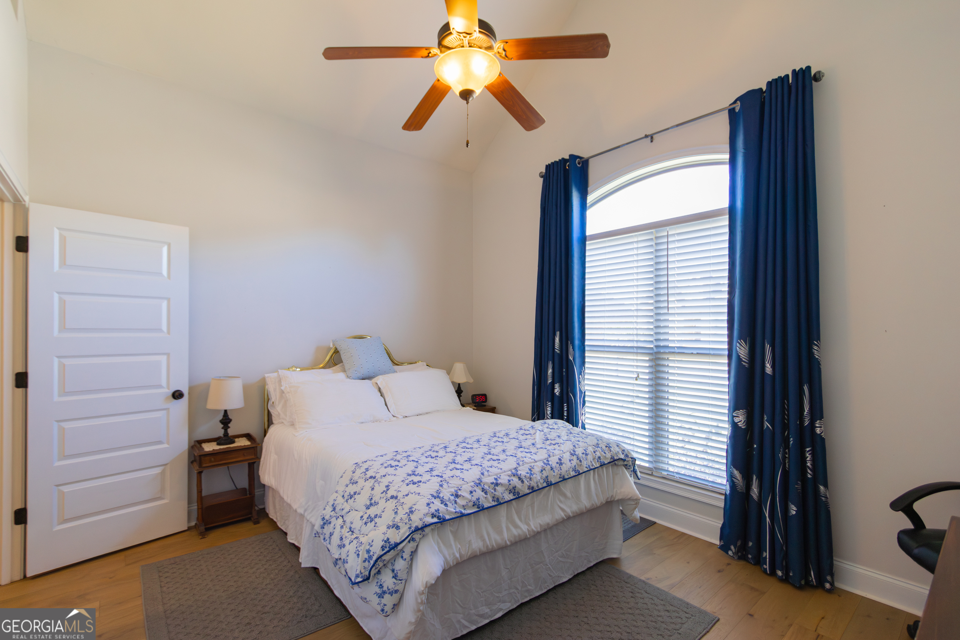 135 Parkview Grove Kathleen, GA 31047 - Photo 12 of 35 a bedroom with a bed and a chandelier