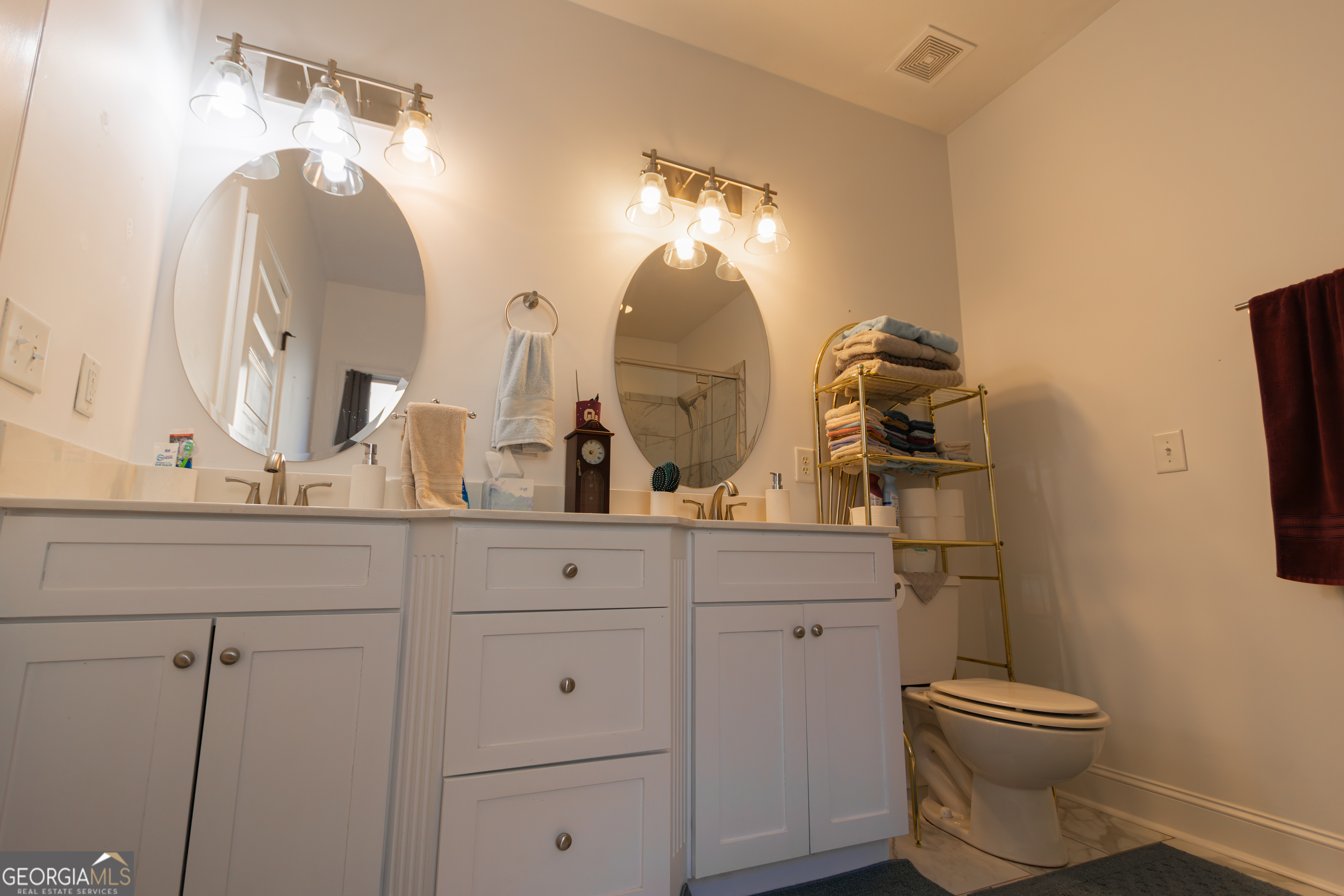 135 Parkview Grove Kathleen, GA 31047 - Photo 23 of 35 a bathroom with a toilet sink and mirror