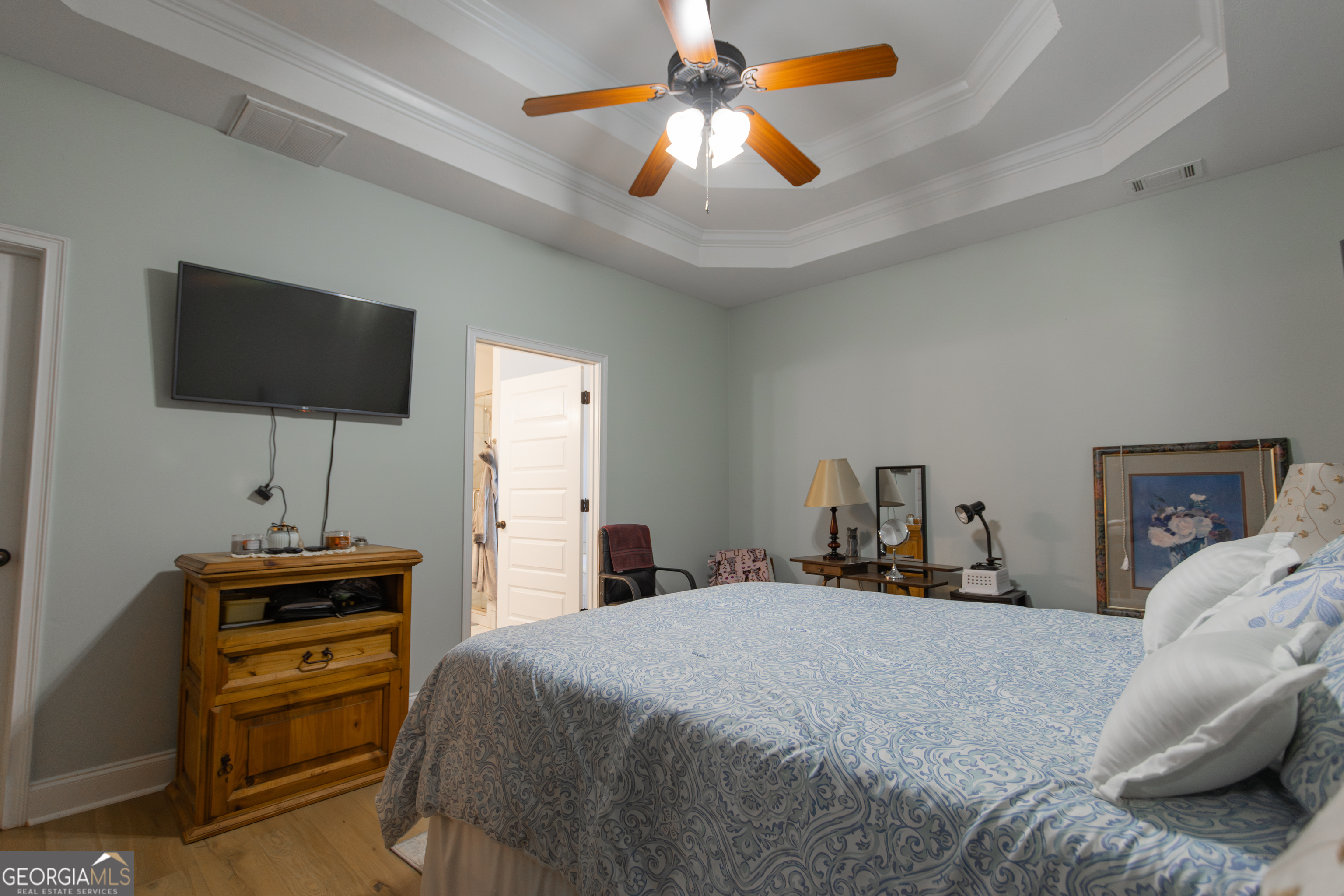 135 Parkview Grove Kathleen, GA 31047 - Photo 26 of 35 a bedroom with a bed and a flat screen tv