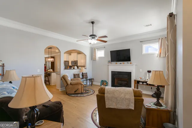 a living room with furniture and a fireplace