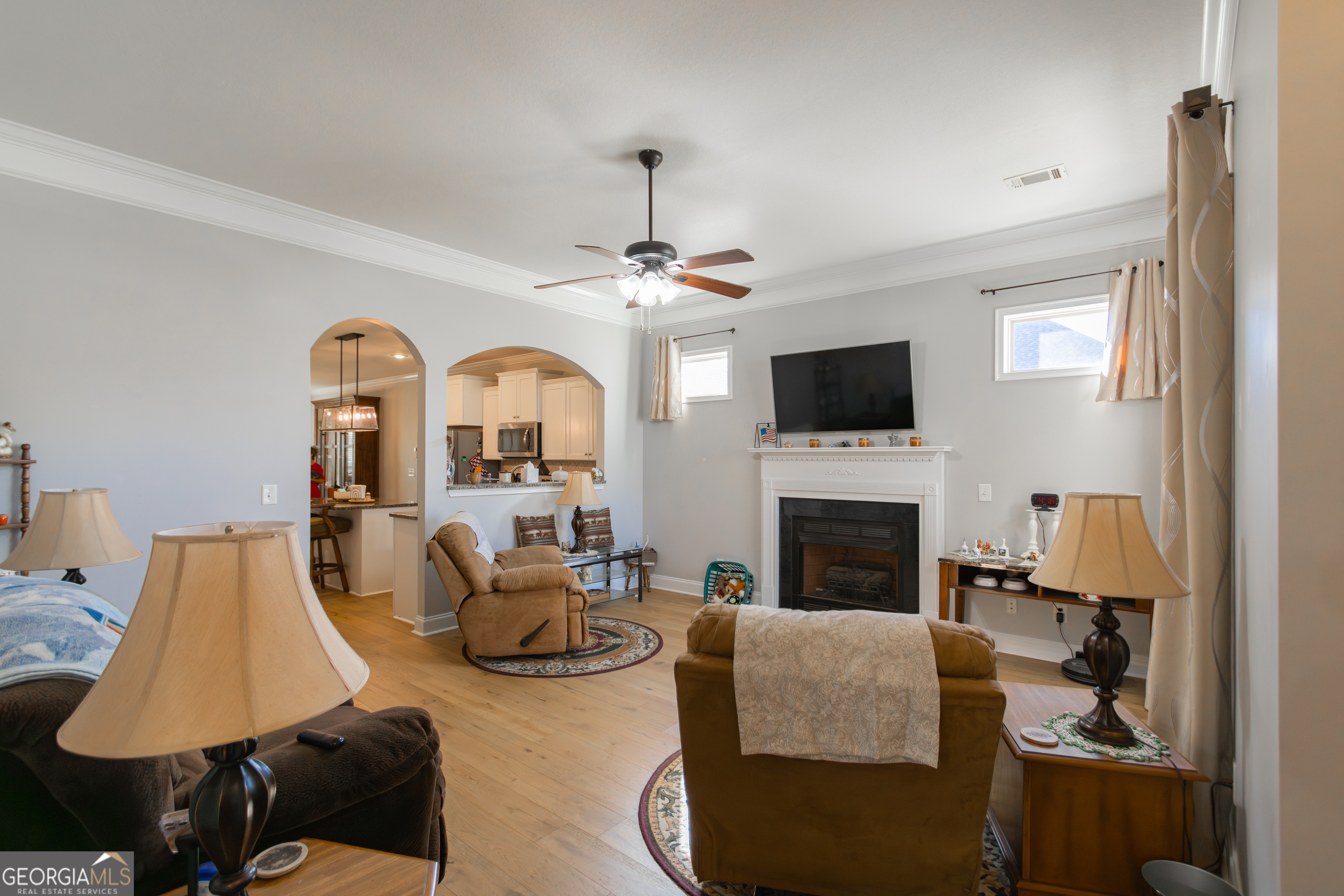 135 Parkview Grove Kathleen, GA 31047 - Photo 34 of 35 a living room with furniture and a fireplace