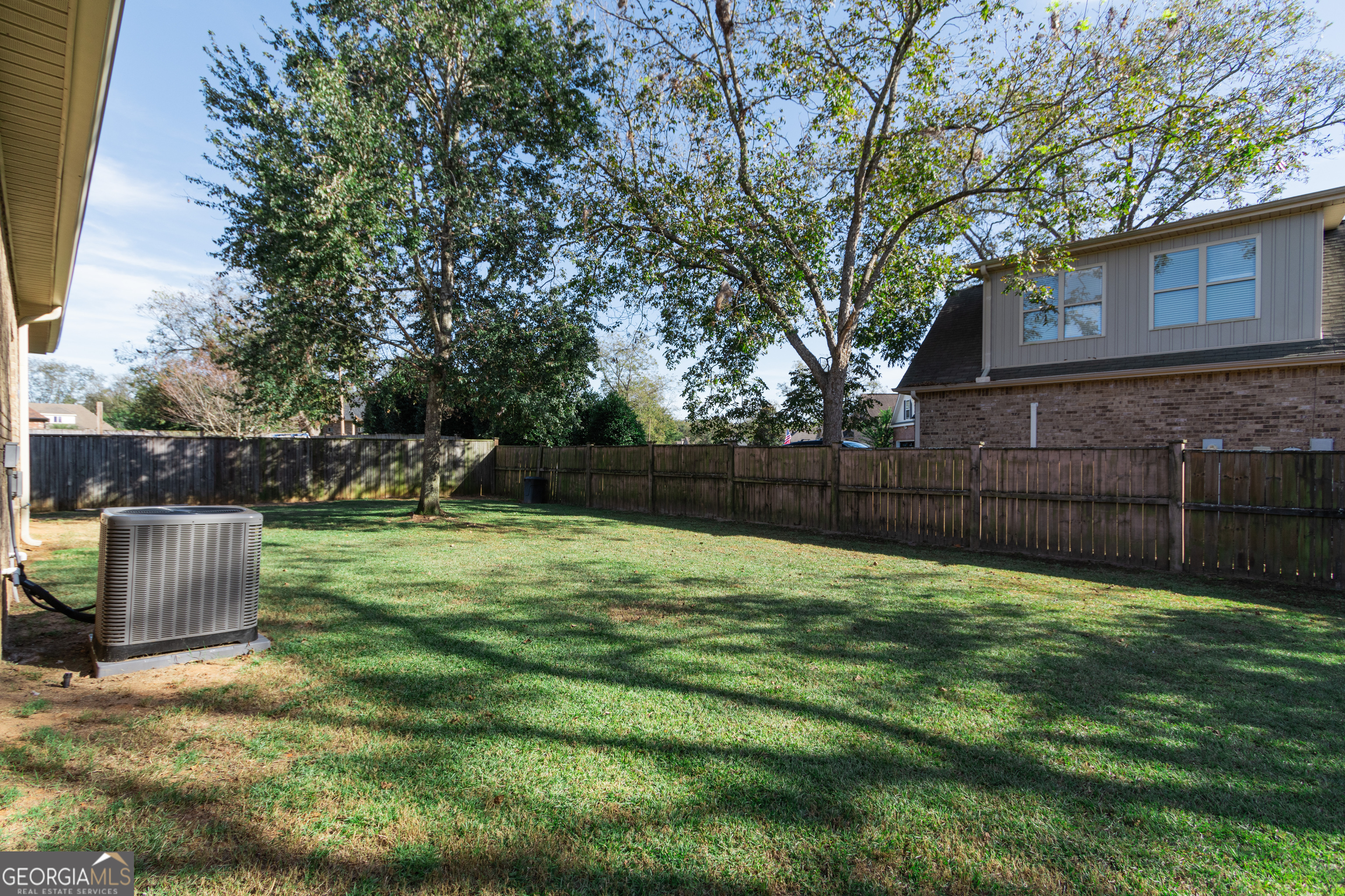 135 Parkview Grove Kathleen, GA 31047 - Photo 6 of 35 a view of a backyard with a tree