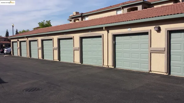 a front view of a house with sitting area