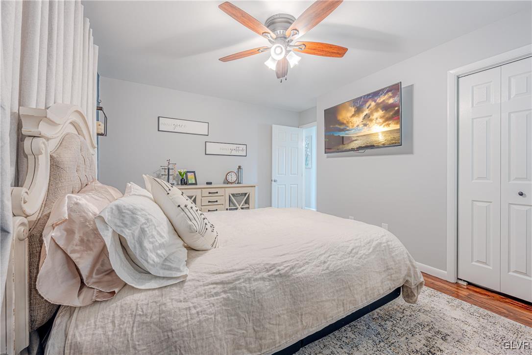 413 South Miller Street Shillington, PA 19607 - Photo 17 of 36 a bedroom with a bed and a chandelier