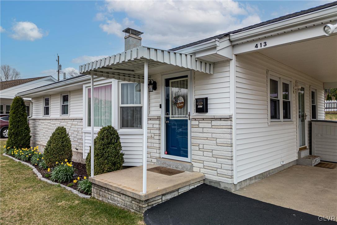 413 South Miller Street Shillington, PA 19607 - Photo 23 of 36 a front view of a house with garden
