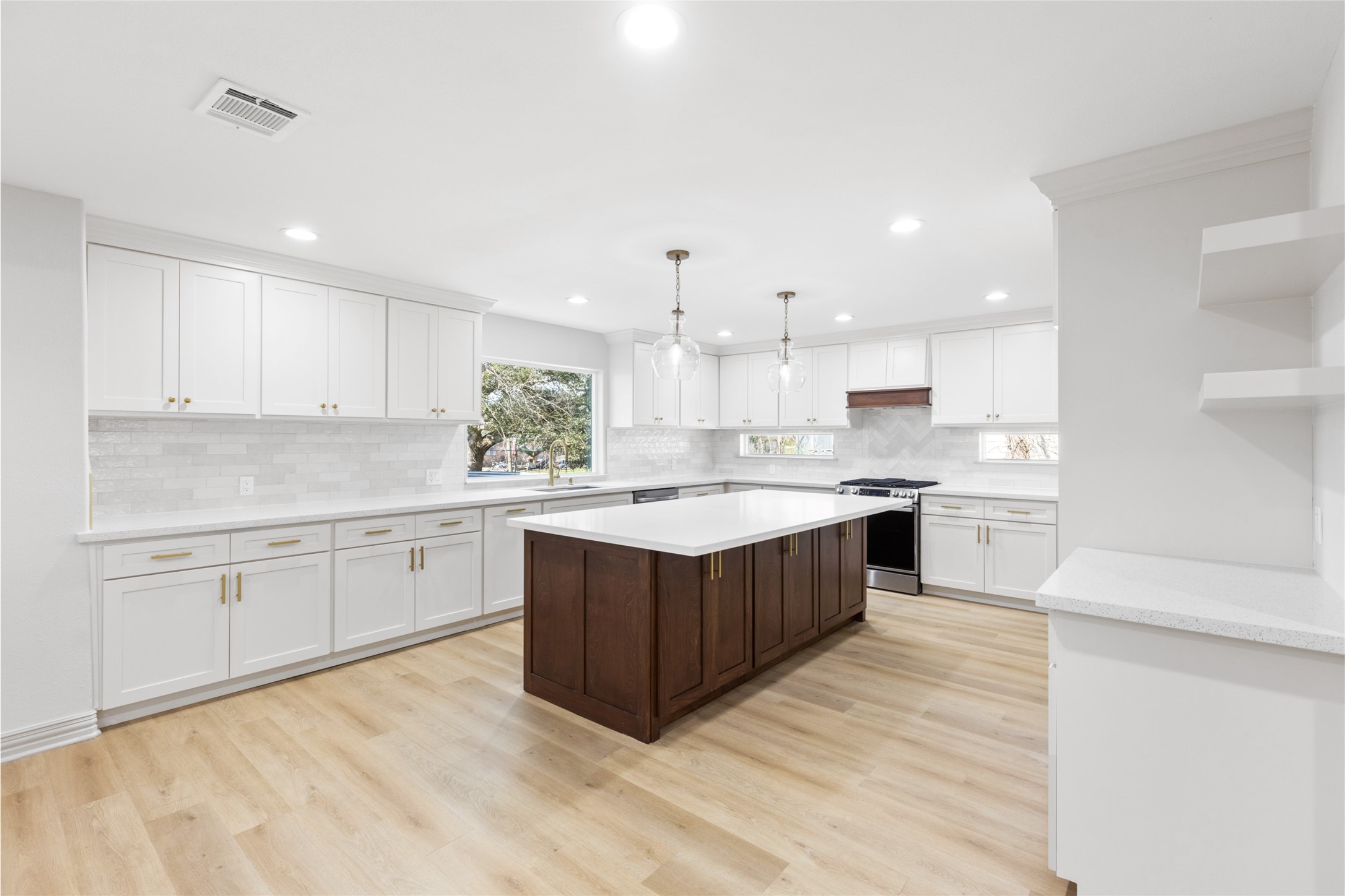 925 County Road 737B Alvin, TX 77511 - Photo 3 of 28 Kitchen includes quartz countertop island that can accommodate stool seating