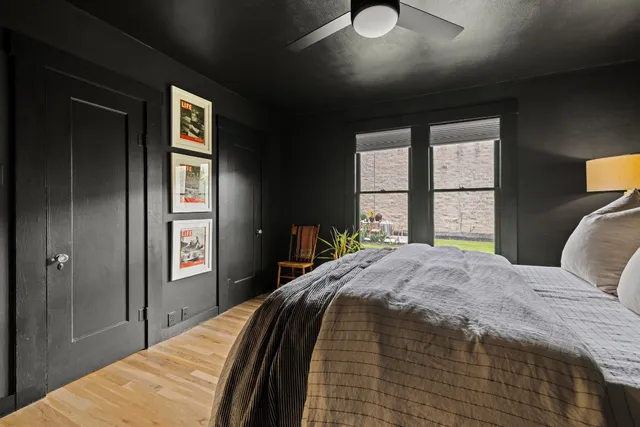 a bedroom with a bed and a window