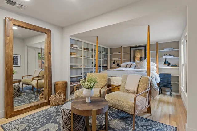 a living room with furniture and a rug