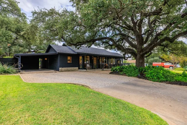 a view of outdoor dining space with a table and chairs