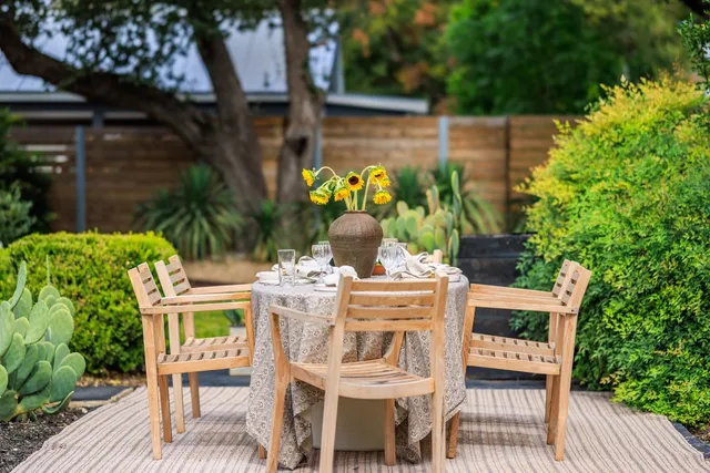 a view of swimming pool with outdoor seating and plants