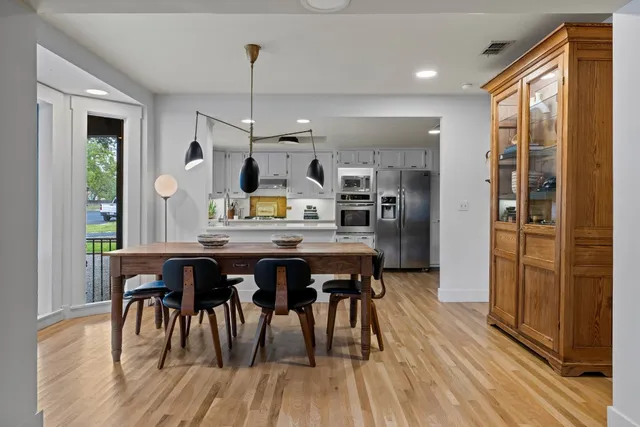 a kitchen with a table and chairs in it