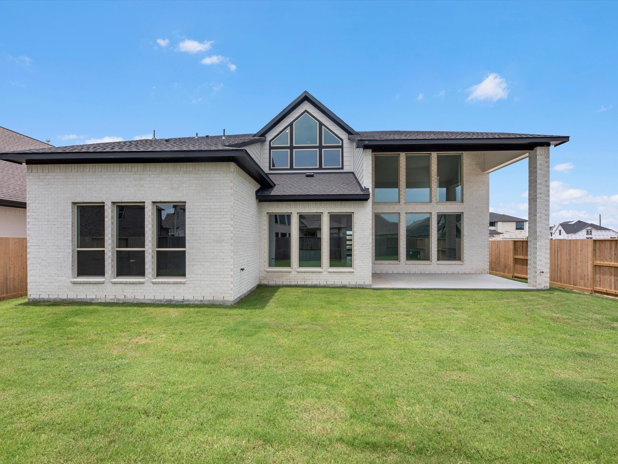 8915 Acropolis Lane Manvel, TX 77578 - Photo 24 of 32 a view of a house with a yard and balcony