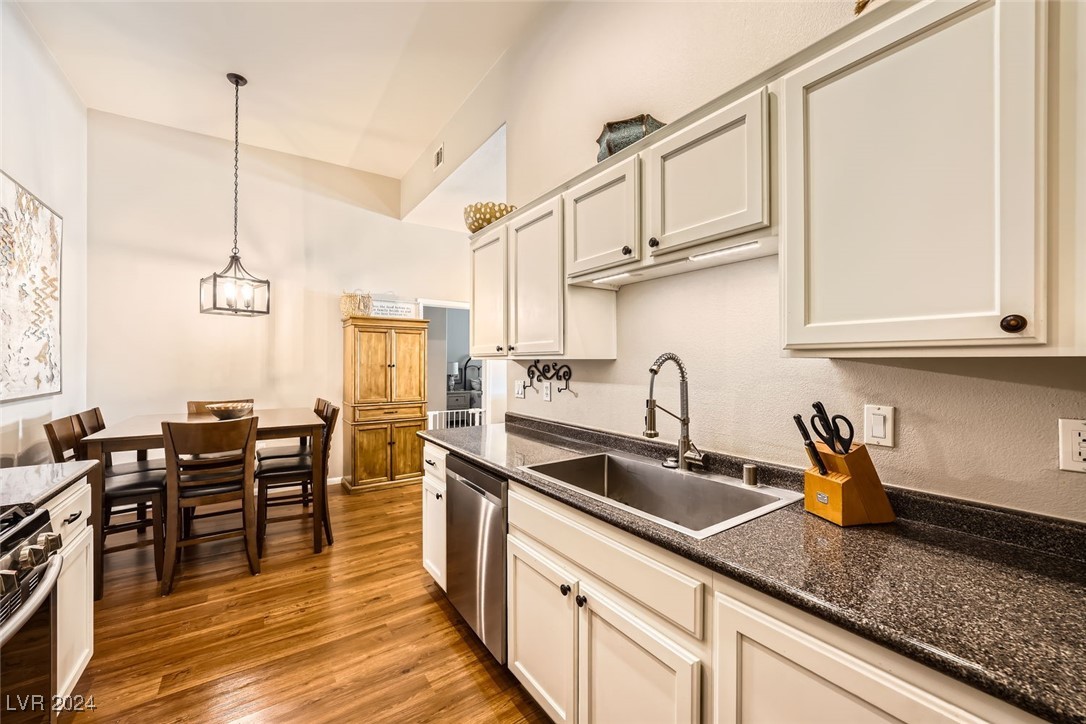 Kitchen featuring Stainless Steel Appliances, Granite Countertops & Freshly painted Modern White Cabinets